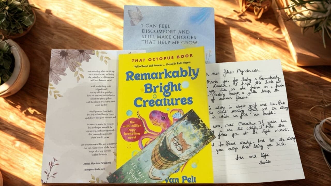 A curated book with a bookmark and a handwritten note from MyndReaders